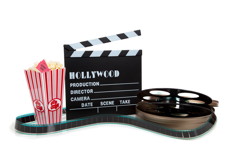 movie-reel-popcorn-header-clapboard-dreamstime_s_11195398